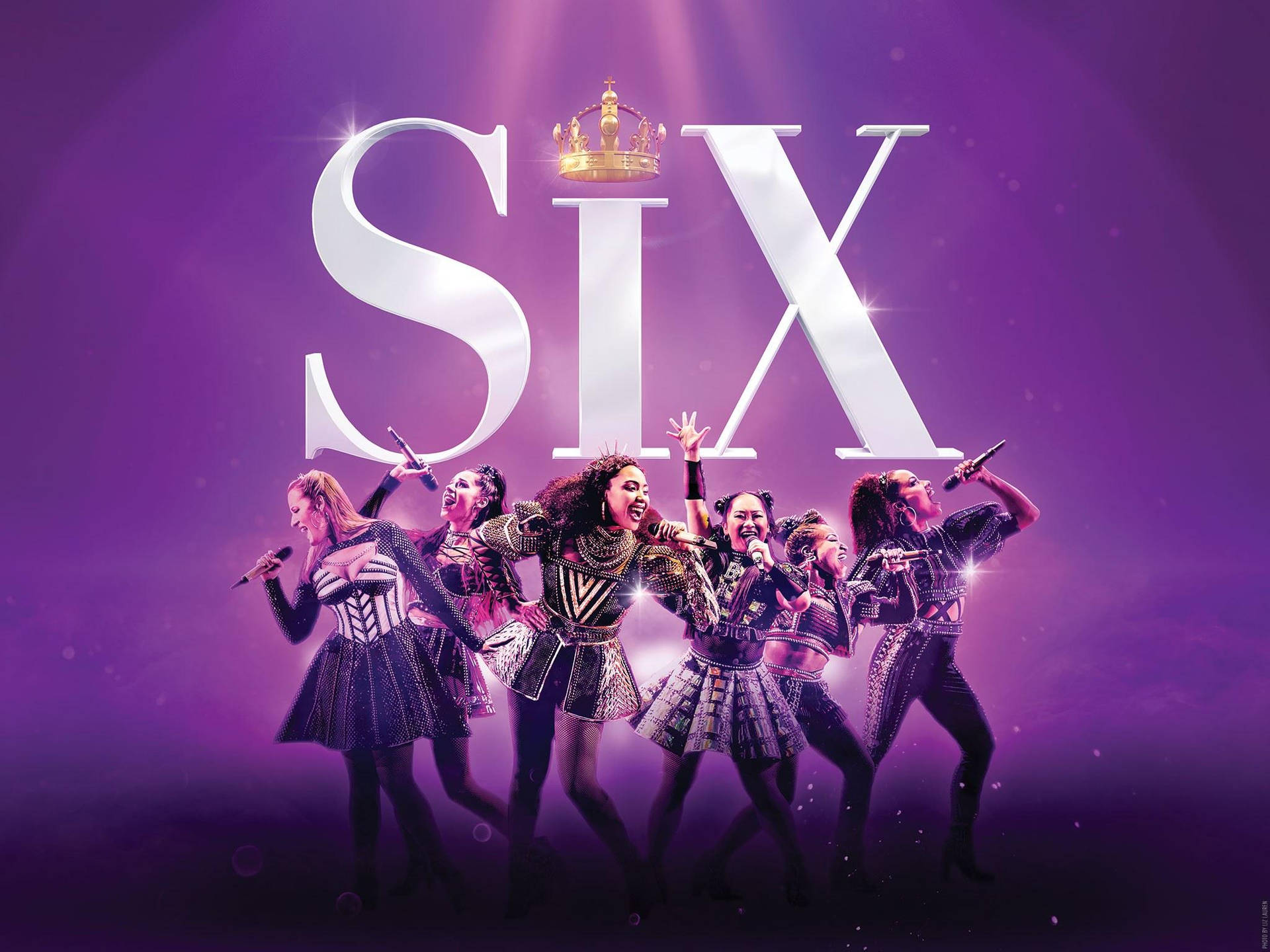 Six the Musical Broadway promotional image featuring the six queens posing dynamically against a vibrant purple backdrop