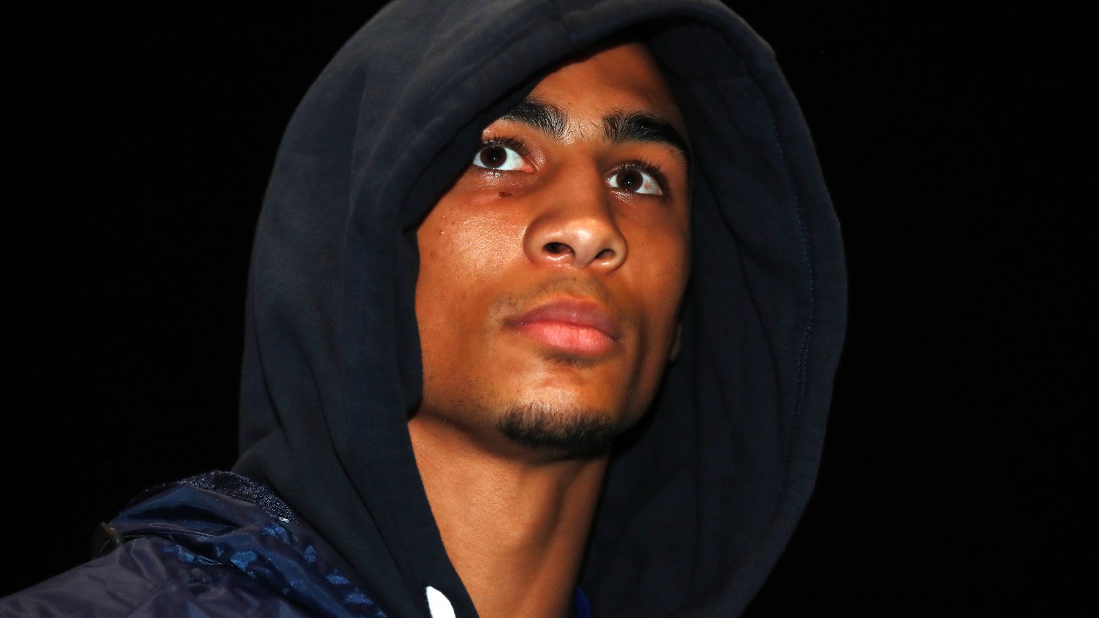 Close-up of Benjamin Whittaker, the British professional boxer, wearing a dark hoodie