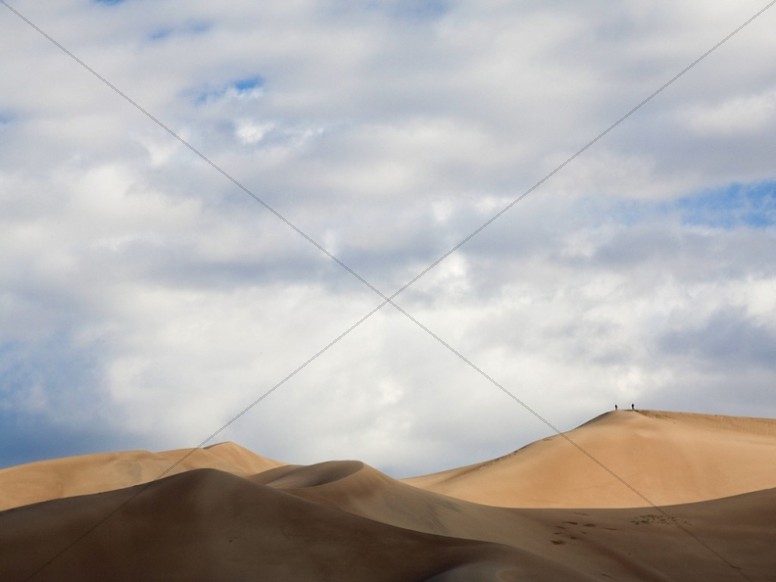 Desert Dunes With Cloudy Sky