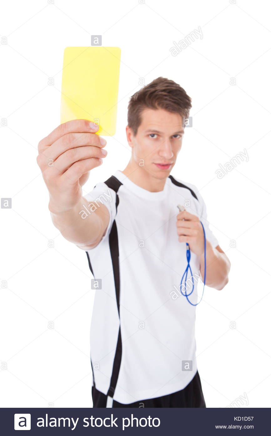 Young Soccer Referee Showing Yellow Card On White Background Stock