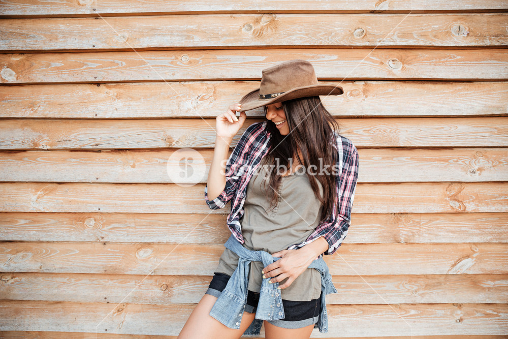 Cheerful Cute Young Woman Cowgirl Standing And Laughing Over