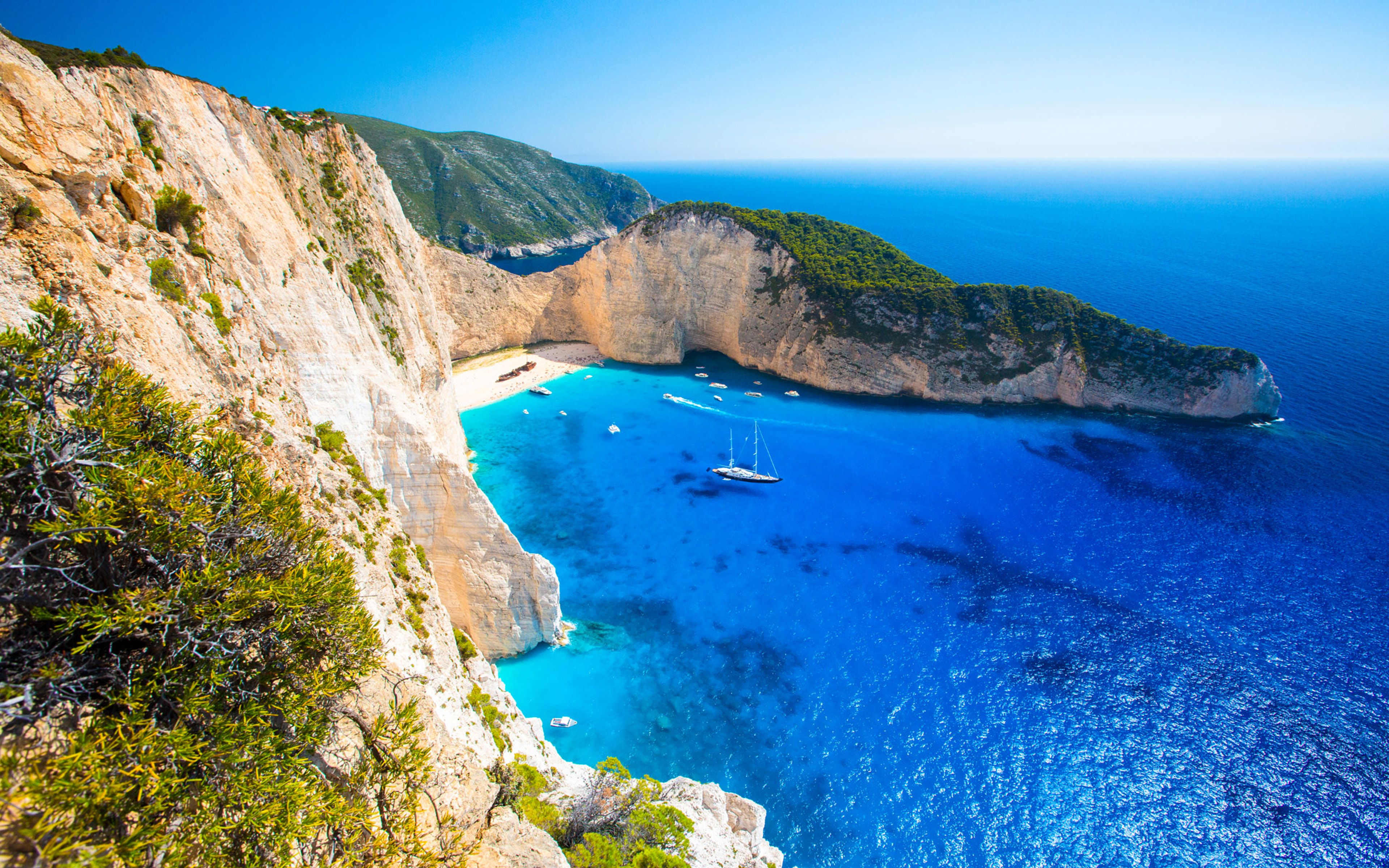 Navagio Beach (Shipwreck Beach) on Zakynthos Island, Greece. Stunning turquoise waters, white sand beach, and towering cliffs create a picturesque scene