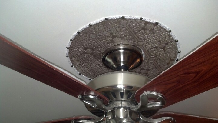 Homemade ceiling medallion with painted wallpaper decorative piping