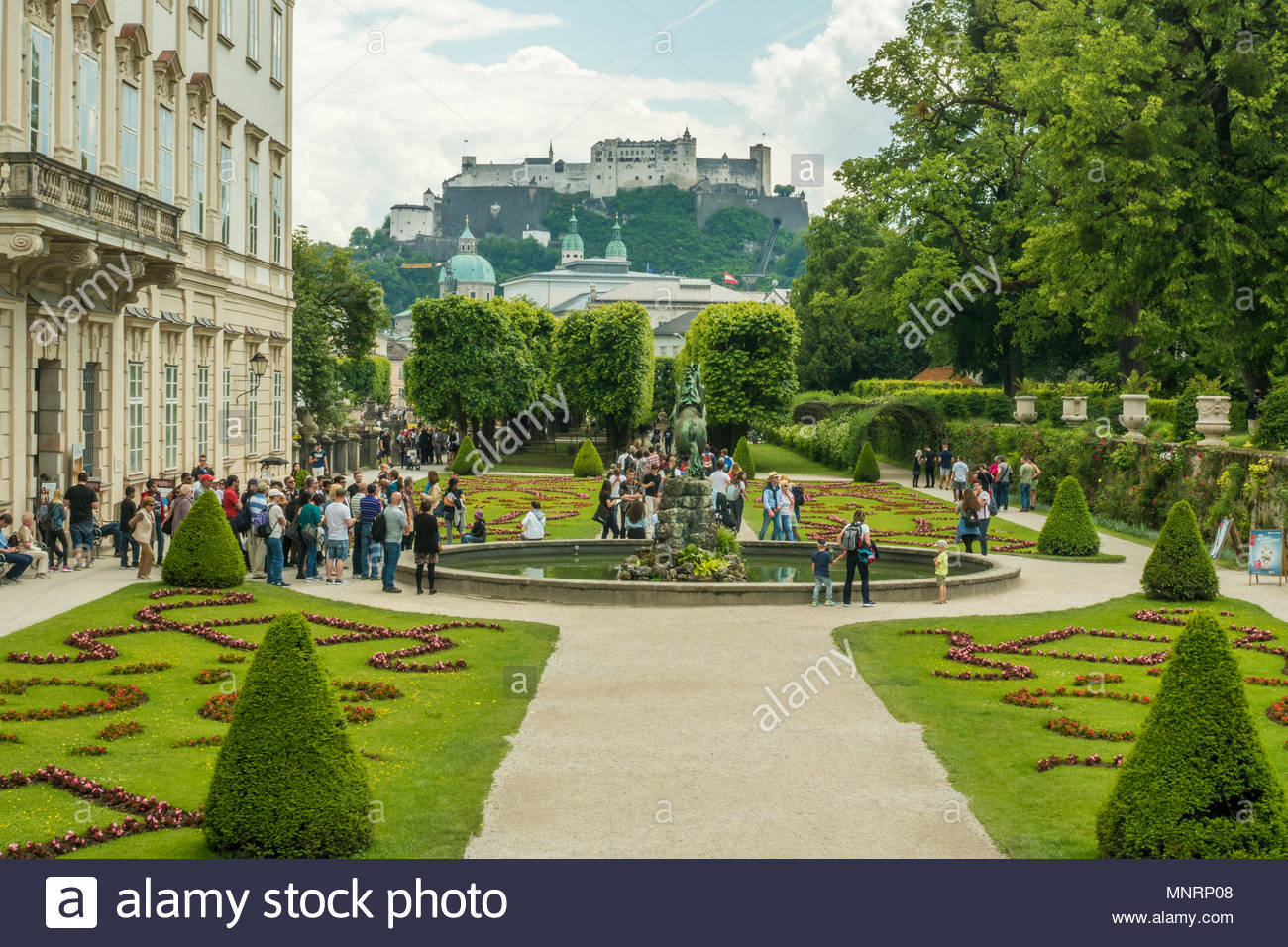 Mirabell Palace And Gardens With Fortress Hohensalzburg In The