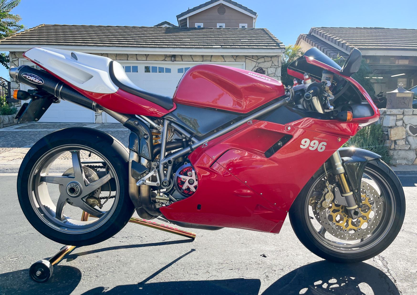 Red Ducati 996 sportbike parked on a driveway