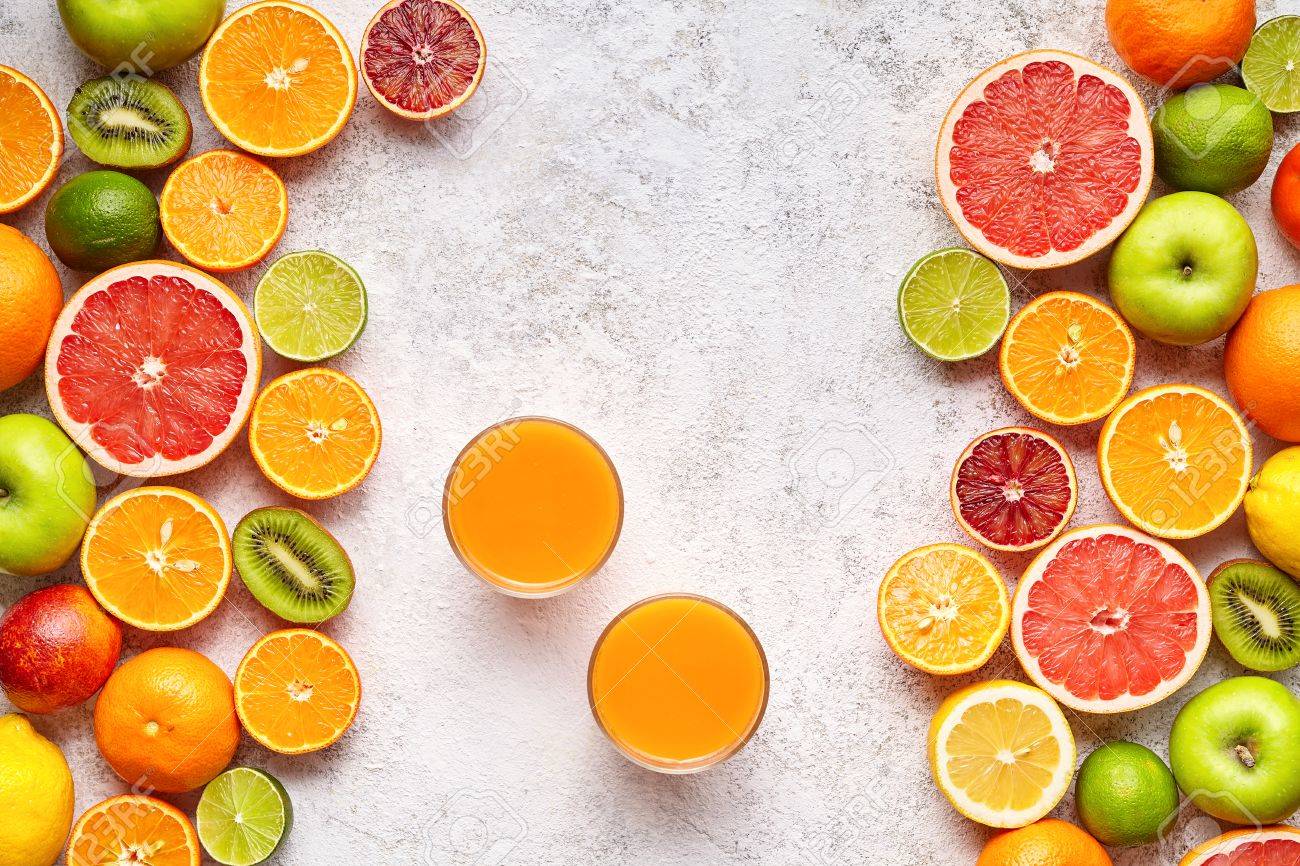 Fresh Juice Vitamin C Drink In Citrus Fruits Background Flat