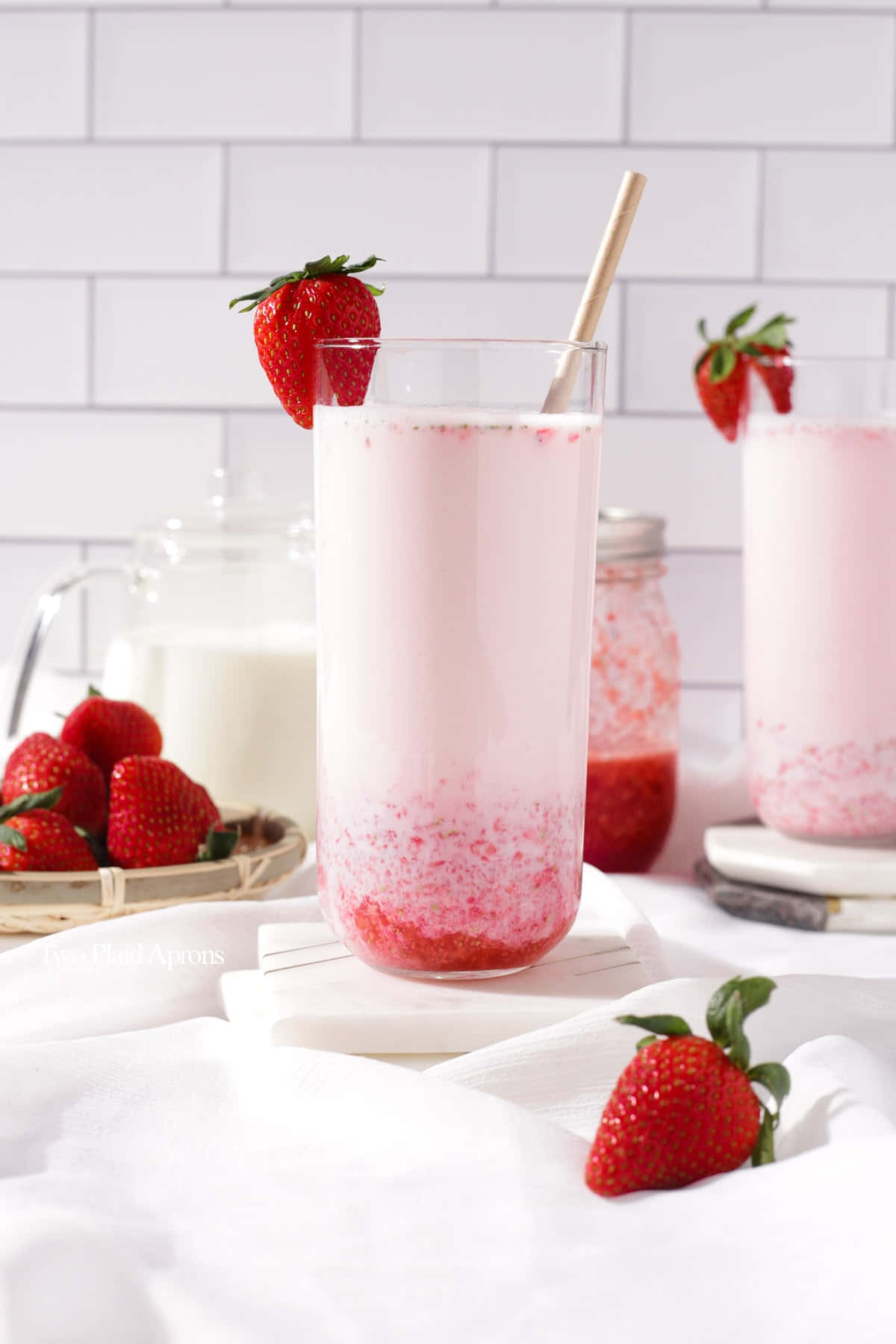 Strawberry Milkshake With Strawberries And A Straw Wallpaper