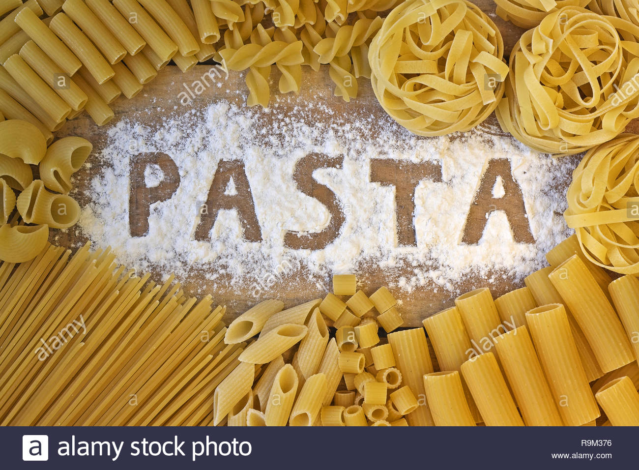 Pasta Word With Wood Background Stock Photo