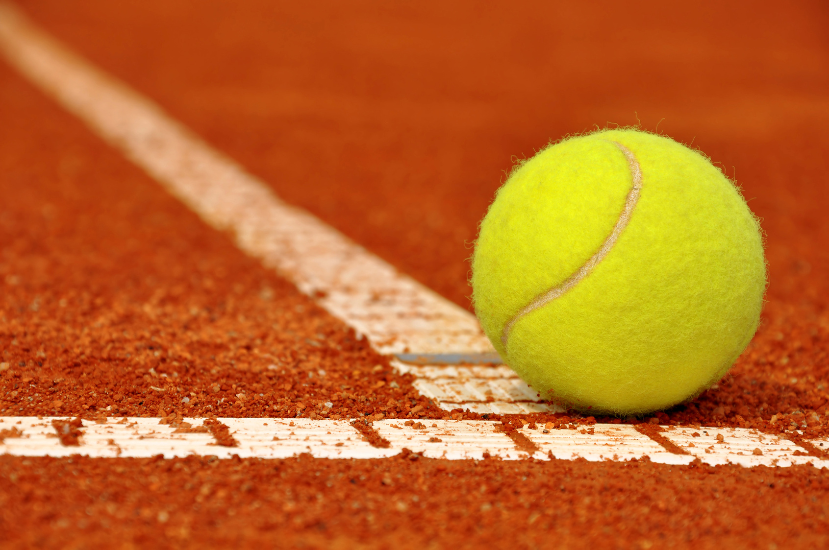 Tennis Ball On A Clay Court