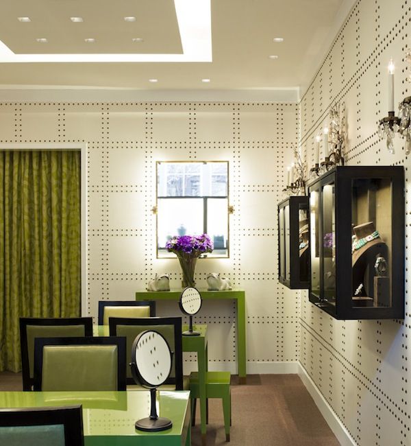 Green retail interior with Rivets wallcovering by Phillip Jeffries