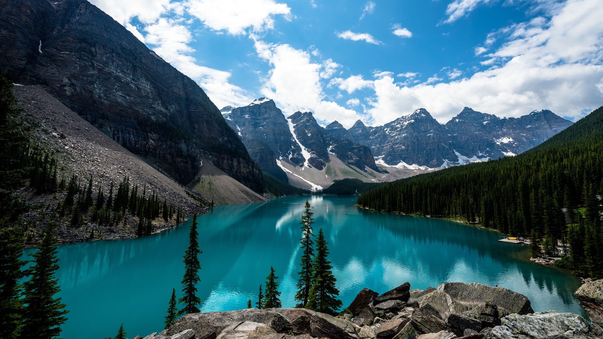 Stunning turquoise lake nestled amidst snow-capped Canadian Rockies, perfect for an HD wallpaper