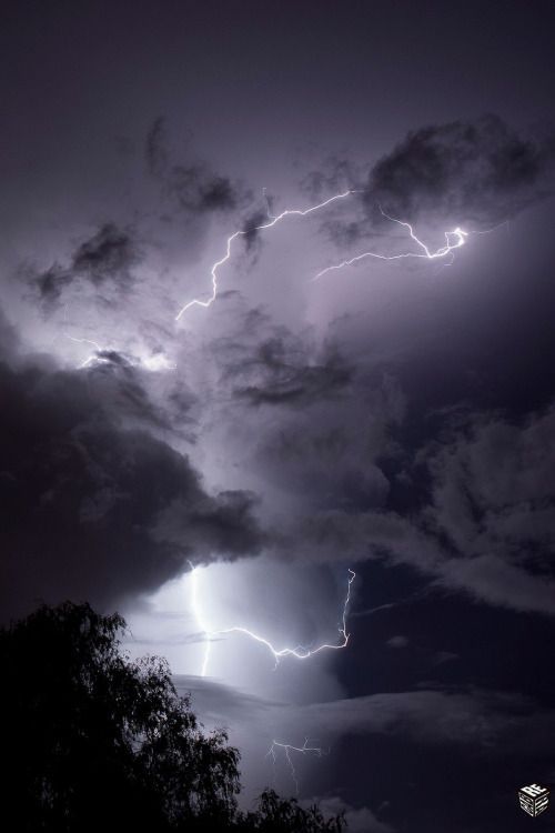 Lightning Strikes Through Dark Clouds Wallpaper