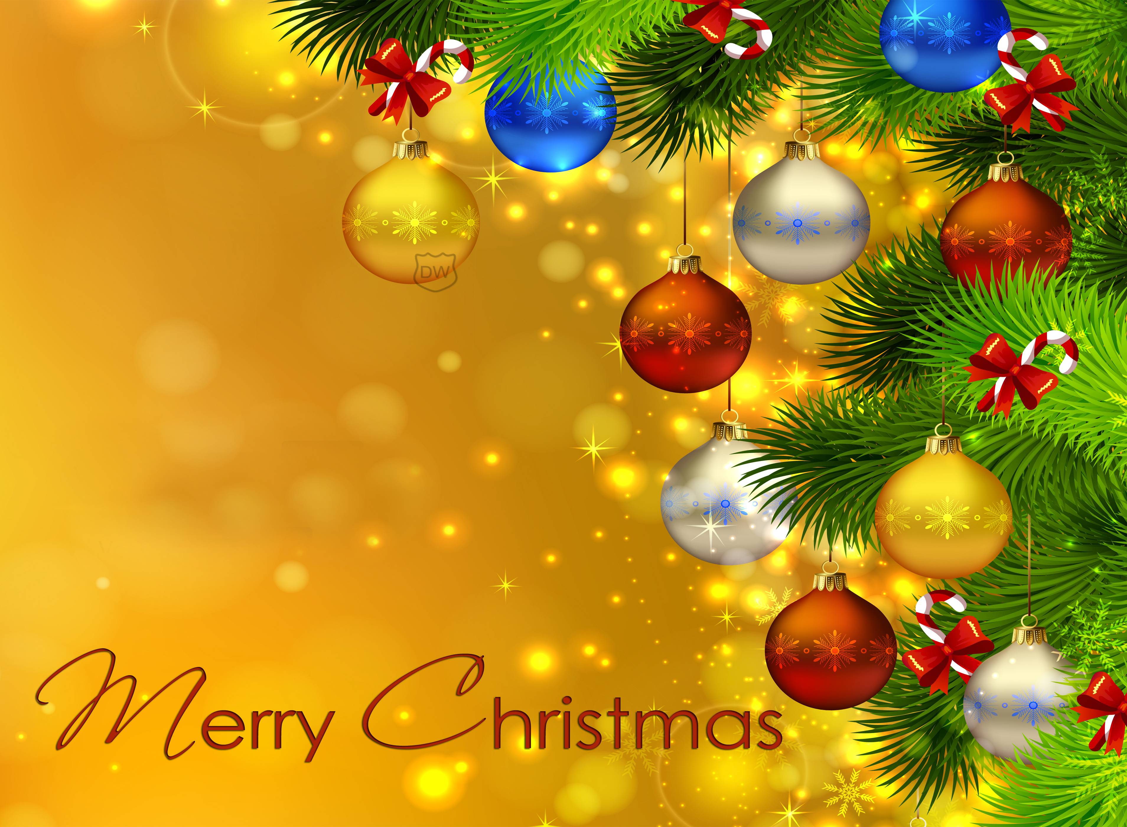Merry Christmas greeting card with colorful ornaments hanging from a fir tree branch on a gold bokeh background
