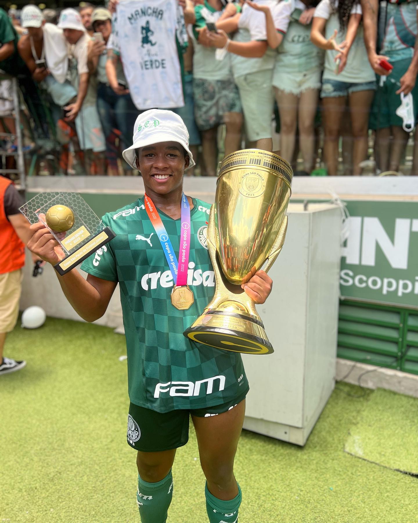 Endrick Felipe celebrates with the Copa São Paulo 2022 trophy and the Golden Ball award