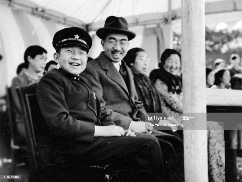 Emperor Hirohito And Crown Prince Akihito Smile As They Watch The