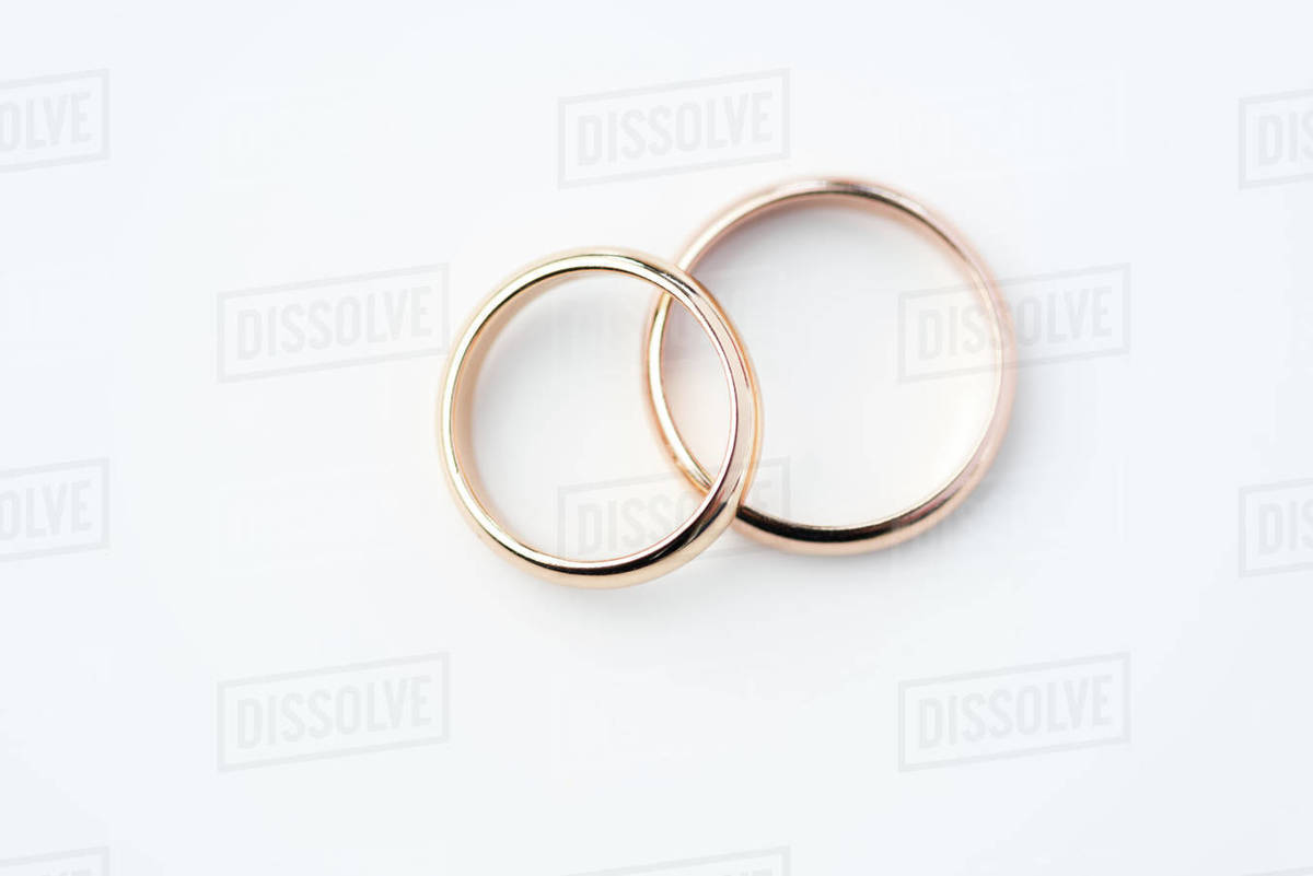 Two Golden Wedding Rings Isolated On White