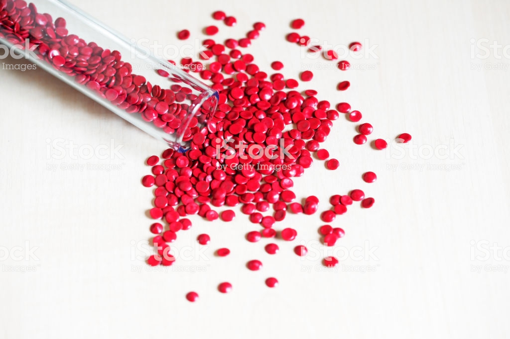 Close Up Of Red Industry Plastic Pellete Polymer Granules