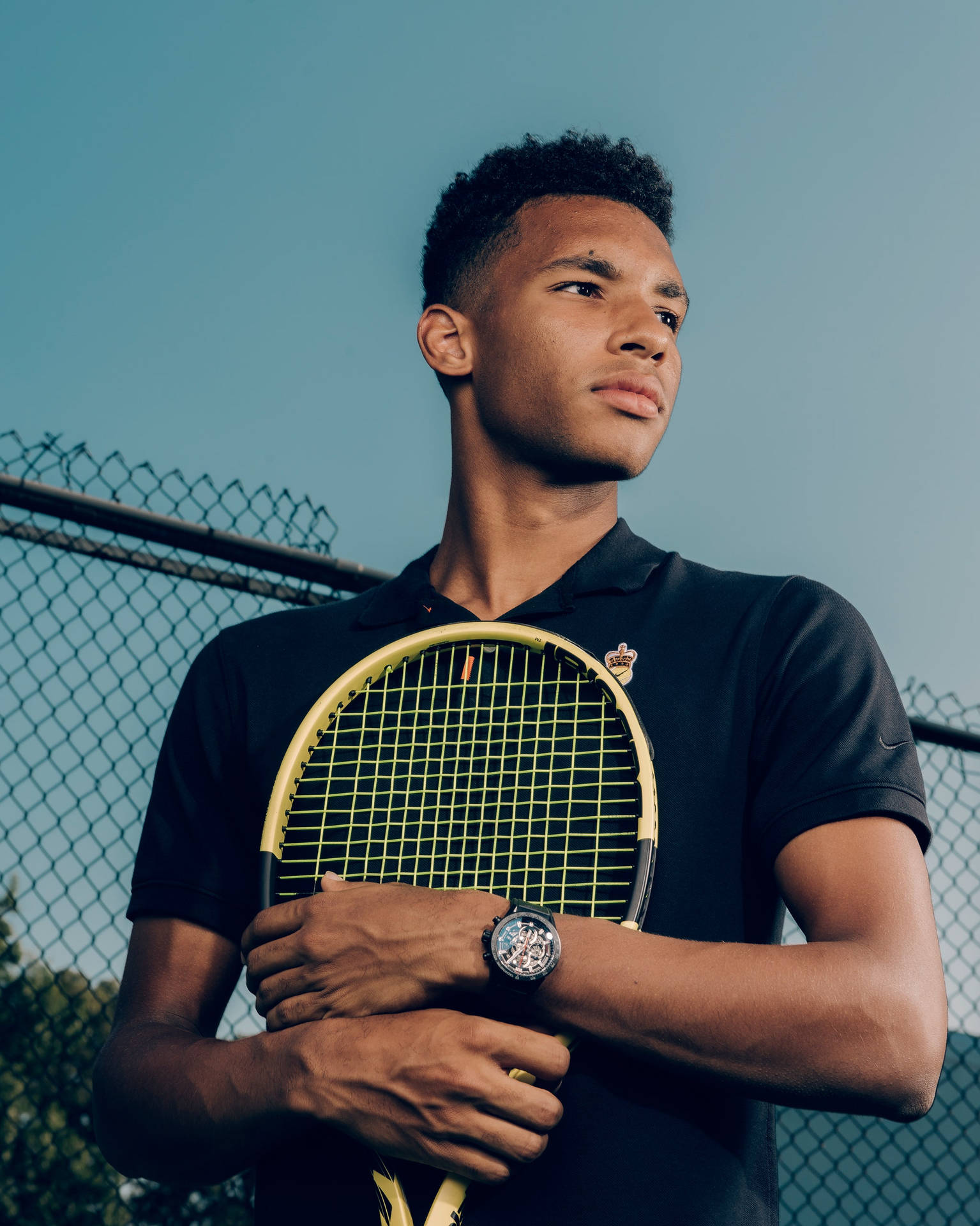 Felix Auger Aliassime In An Intense Moment Embracing His Wallpaper