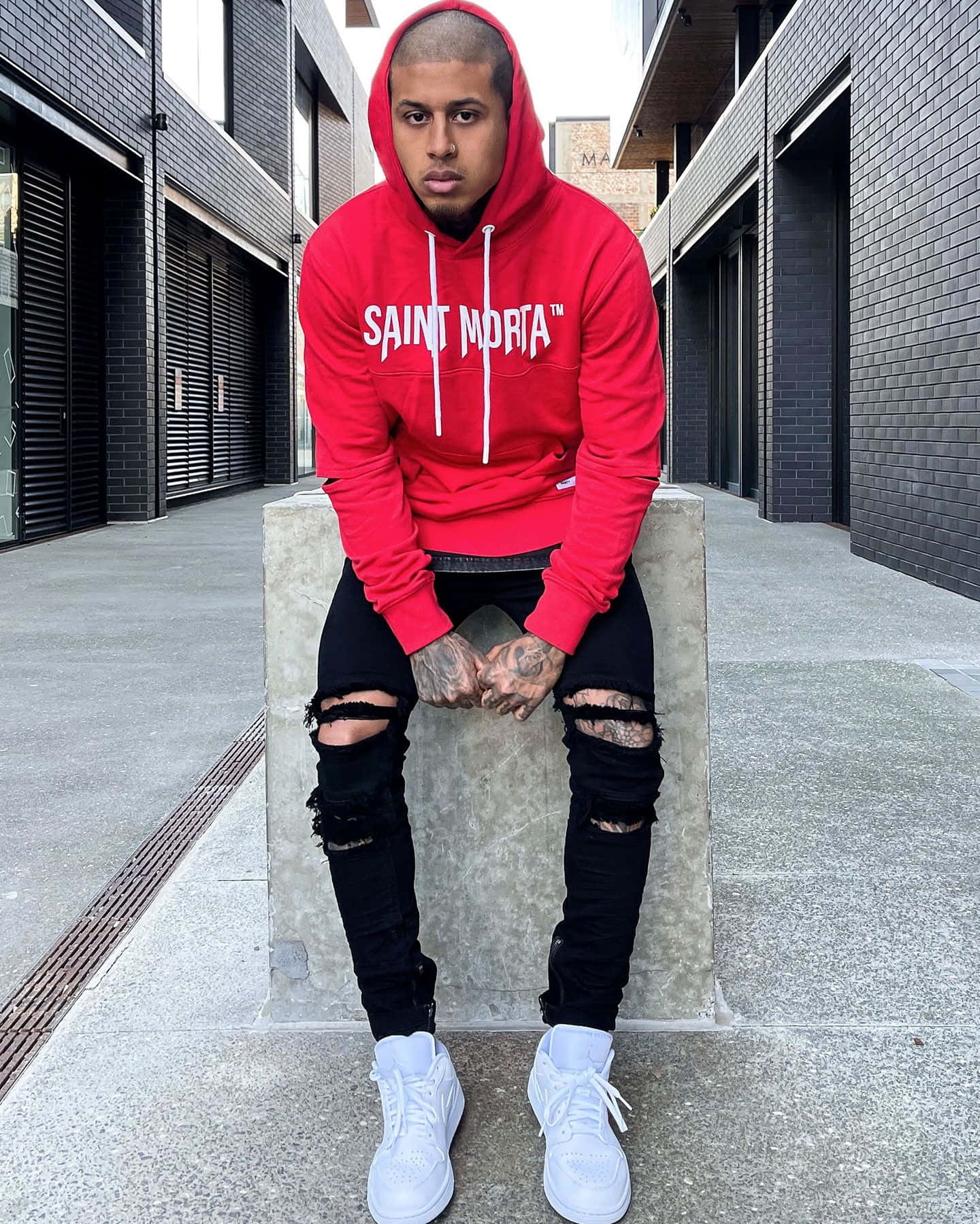 Trendy Red Hoodie On A Minimalist Gray Wallpaper