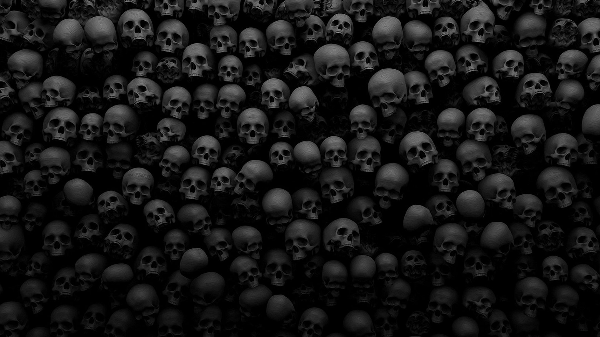 Dark and dense wall of skulls, perfect for a gothic or macabre desktop wallpaper