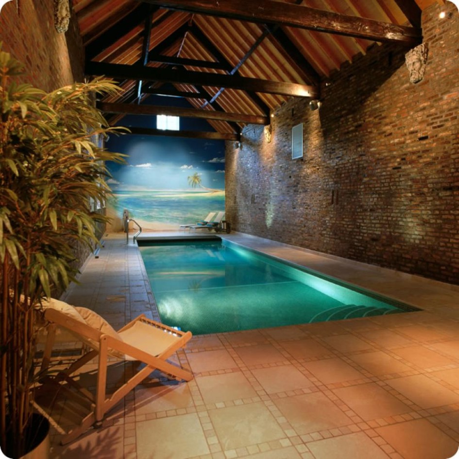Indoor Swimming Pool Design With Wallpaper And Exposed Brick Wall