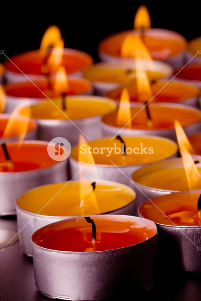 Flaming Candles On A Dark Background Royalty Stock Image