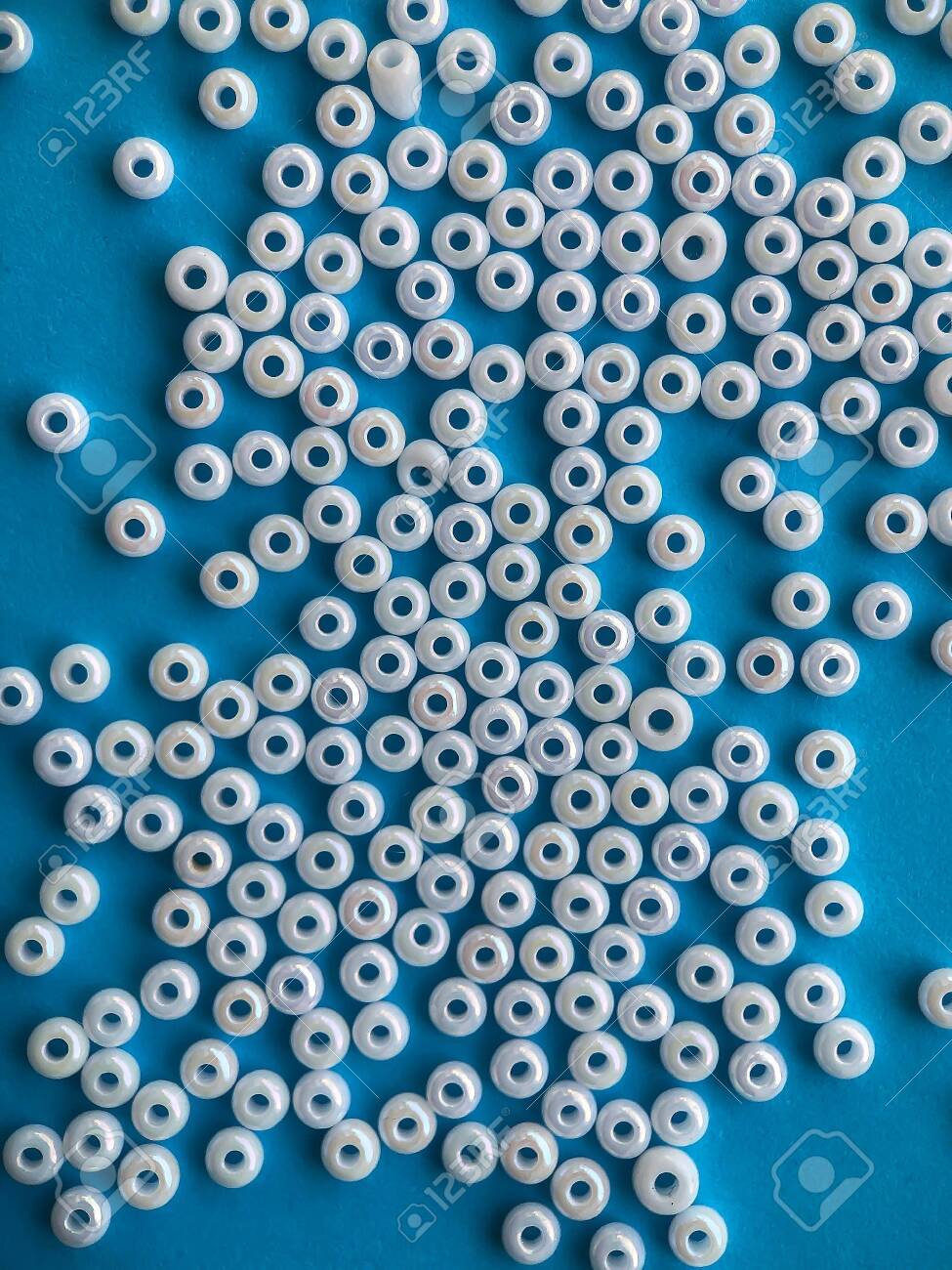 Free download Closeup Of White Beads On A Blue Background Materials For