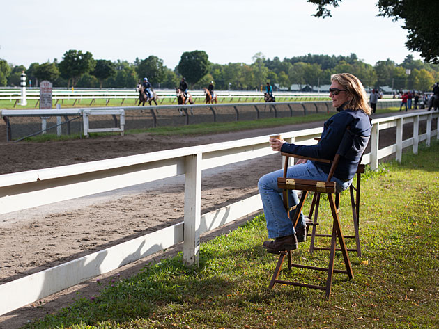 Carefully Observes The Horses Training On Saratoga Race Track