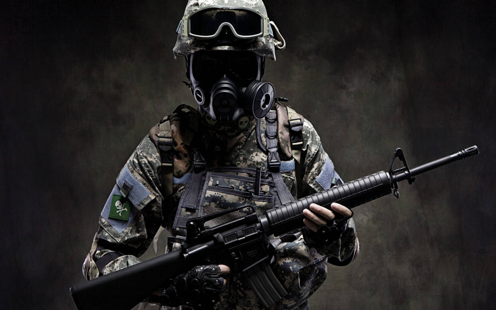 A heavily armed commando in camouflage uniform, gas mask, and goggles, holding an assault rifle