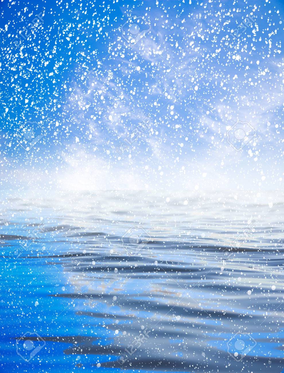 Snowing At Sea With A Beautiful Sky Background Stock