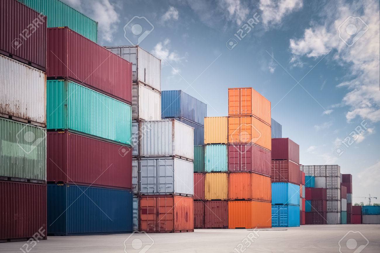 A Pile Of Container In Freight Yard Against Blue Sky Transport