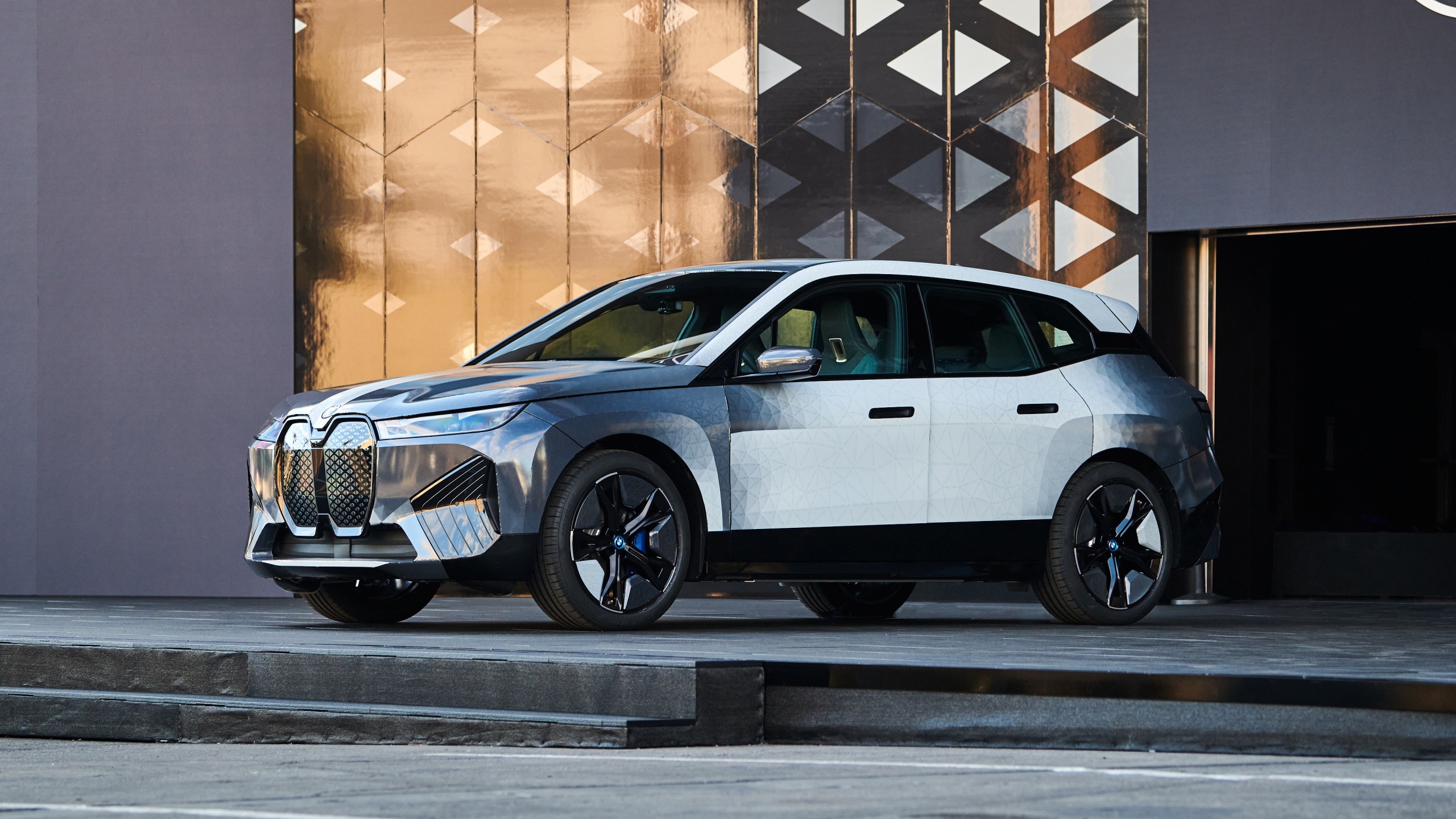 A BMW iX electric SUV, showcasing its futuristic design and sustainable technology