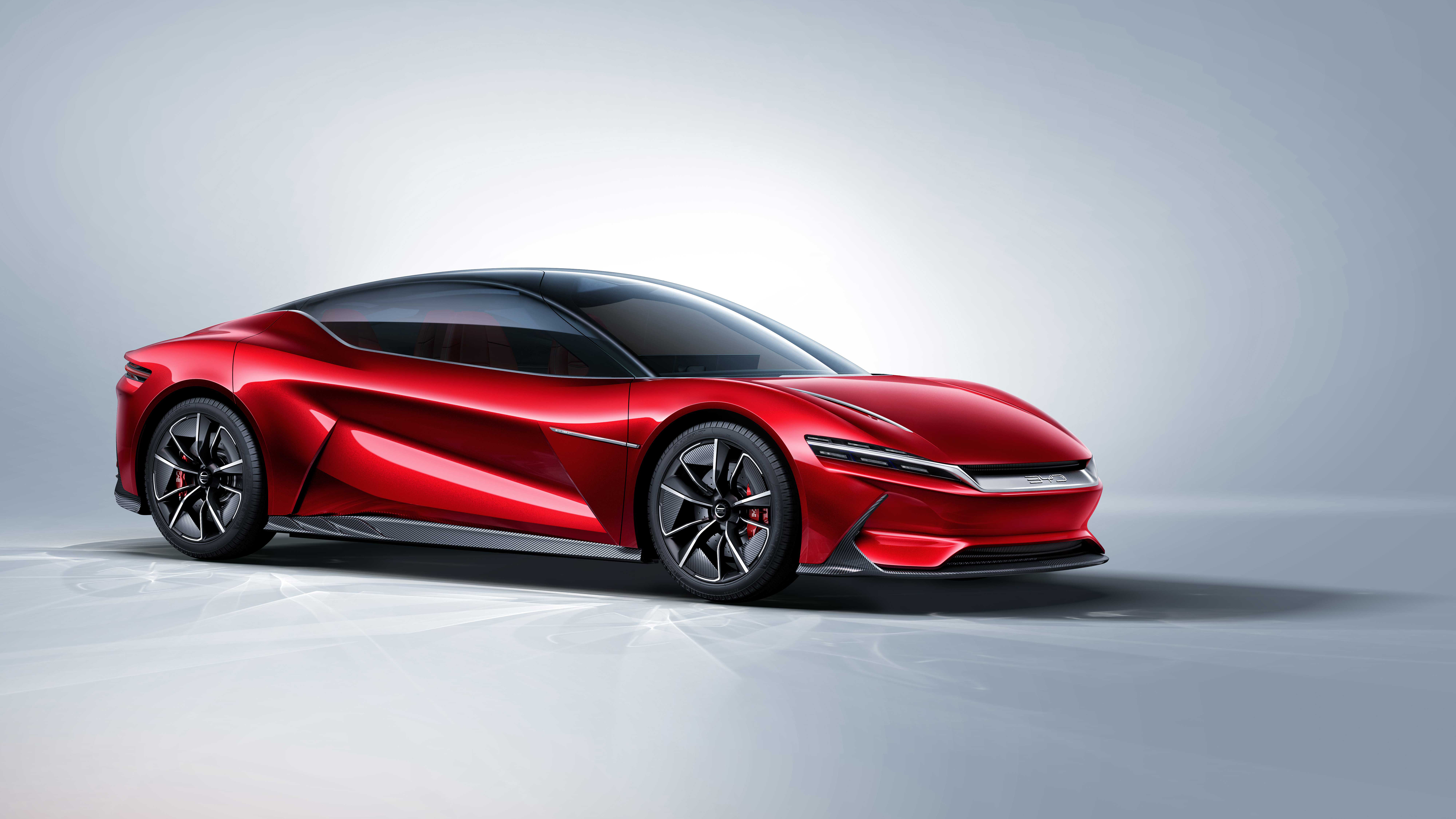 A sleek, red BYD Shark concept car against a minimalist background
