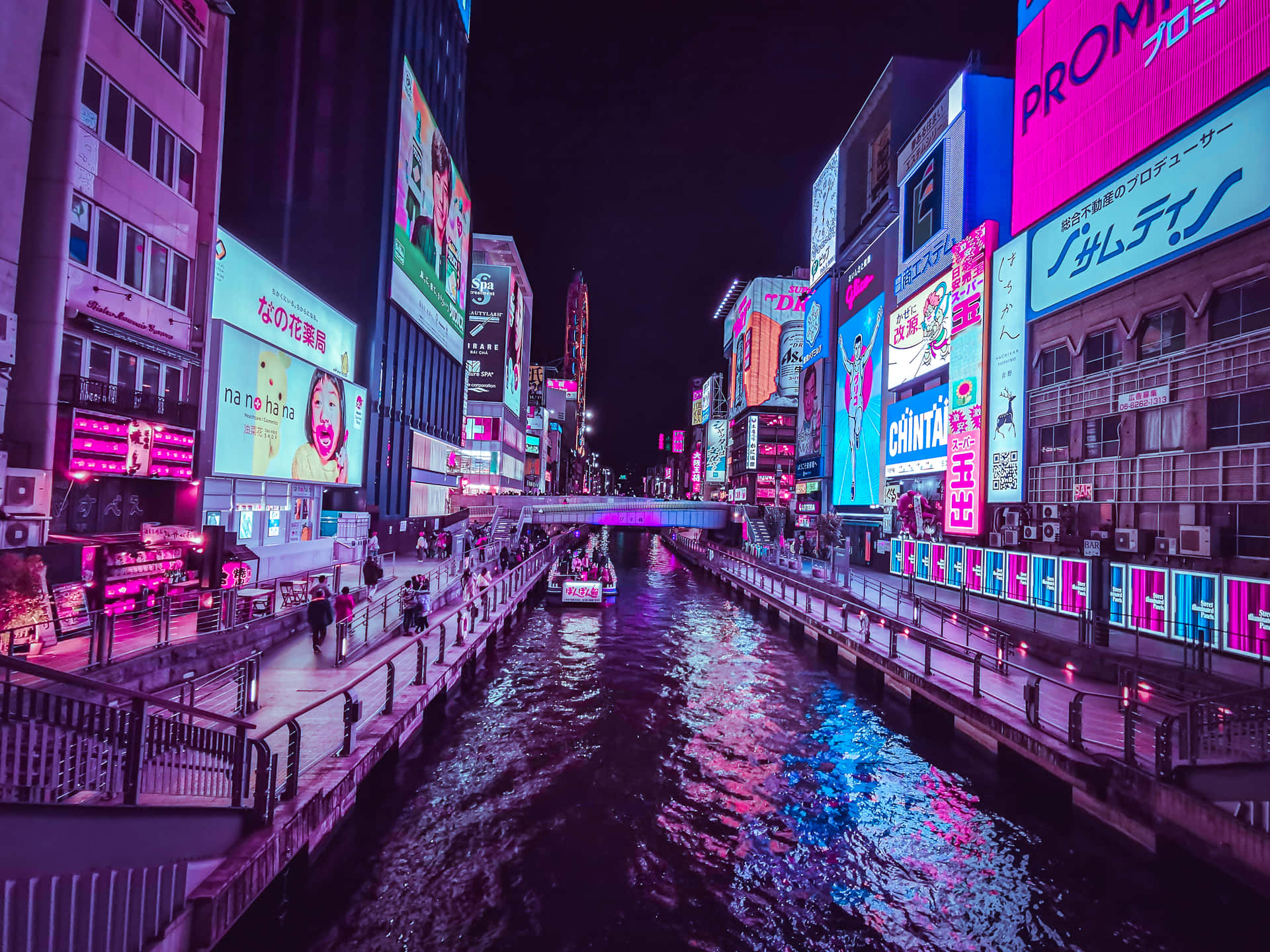A City With Neon Lights And Buildings Wallpaper
