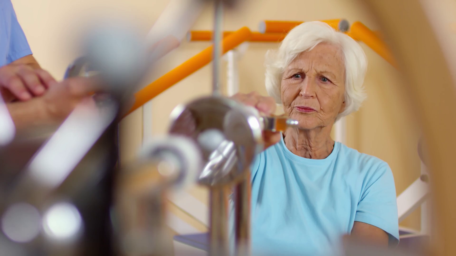 Medium Shot Of Elderly Woman With Grey Hair Using Rotating Wrist