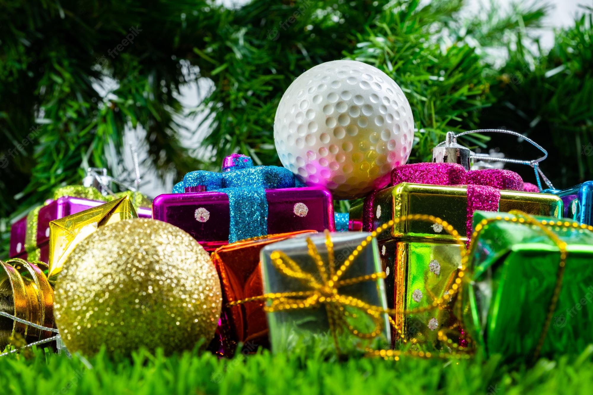 Premium Photo Christmas Gift Box And Golf Ball On Grass