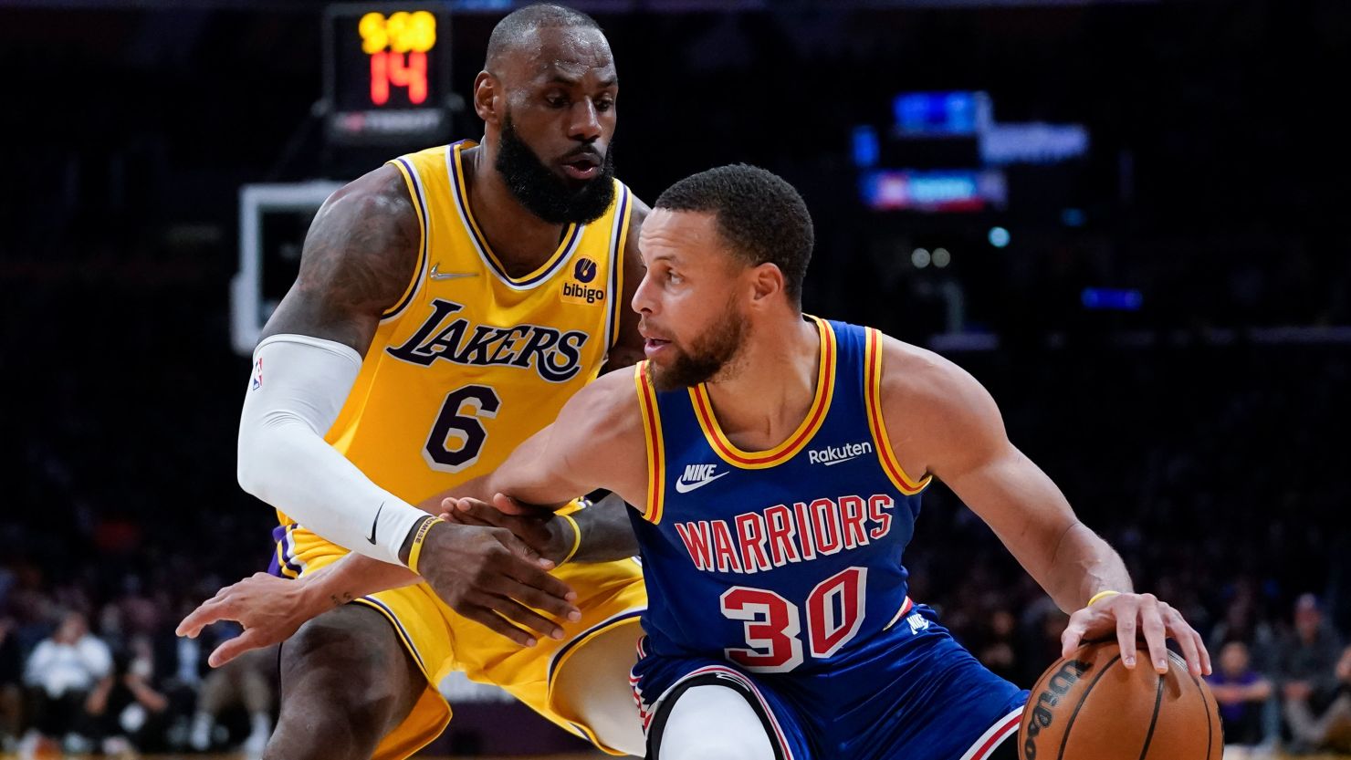 LeBron James and Stephen Curry face off during an NBA game, highlighting their intense rivalry and legendary status in basketball