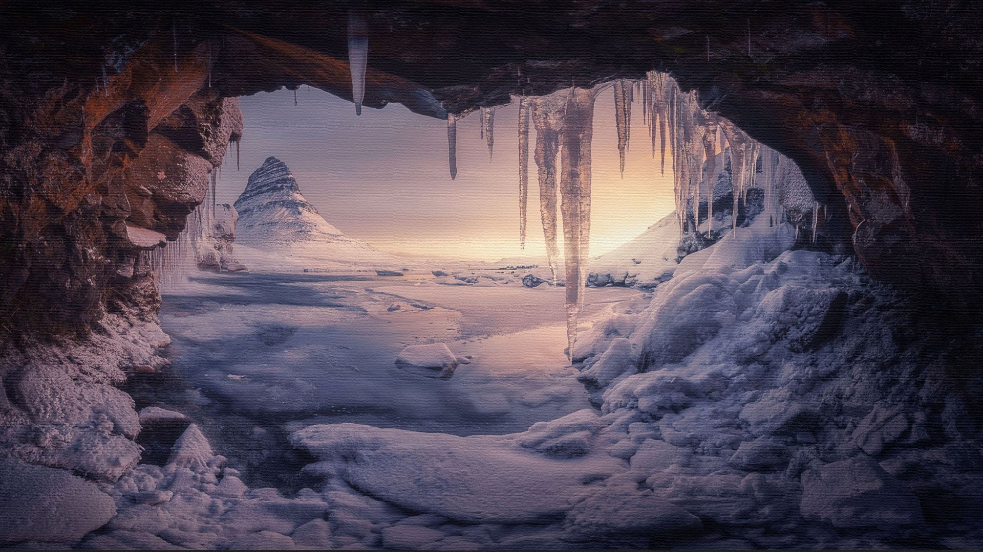 A breathtaking view from inside an ice cave, overlooking a snow-covered landscape with a majestic mountain peak in the background. Icicles hang from the cave's ceiling, adding to the magical winter scene