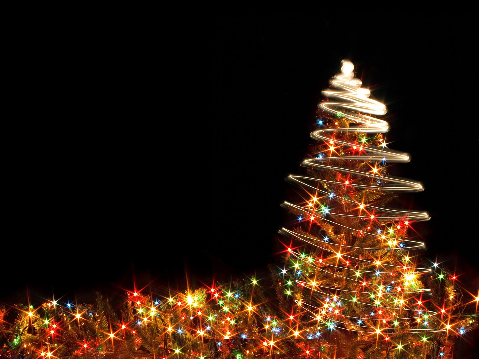 Christmas tree with colorful lights on a dark background, creating a festive holiday scene