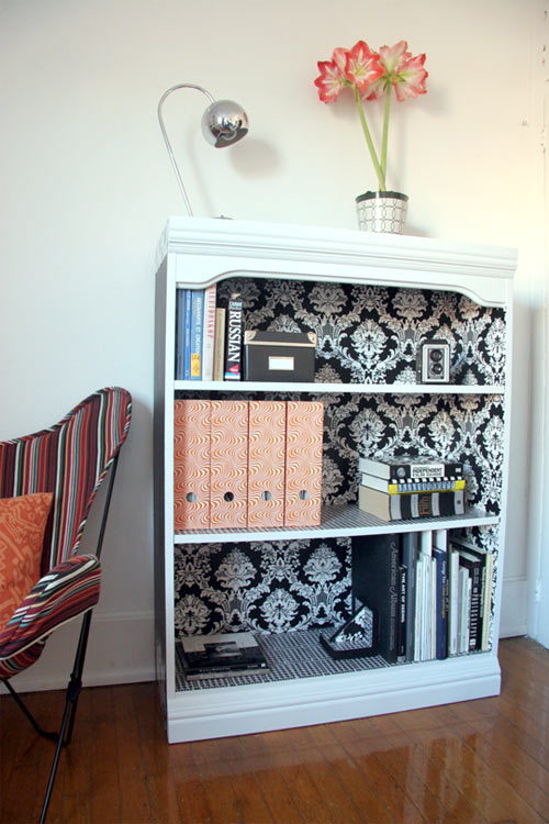 Use wallpaper to line the backs of a boring bookshelf to create a