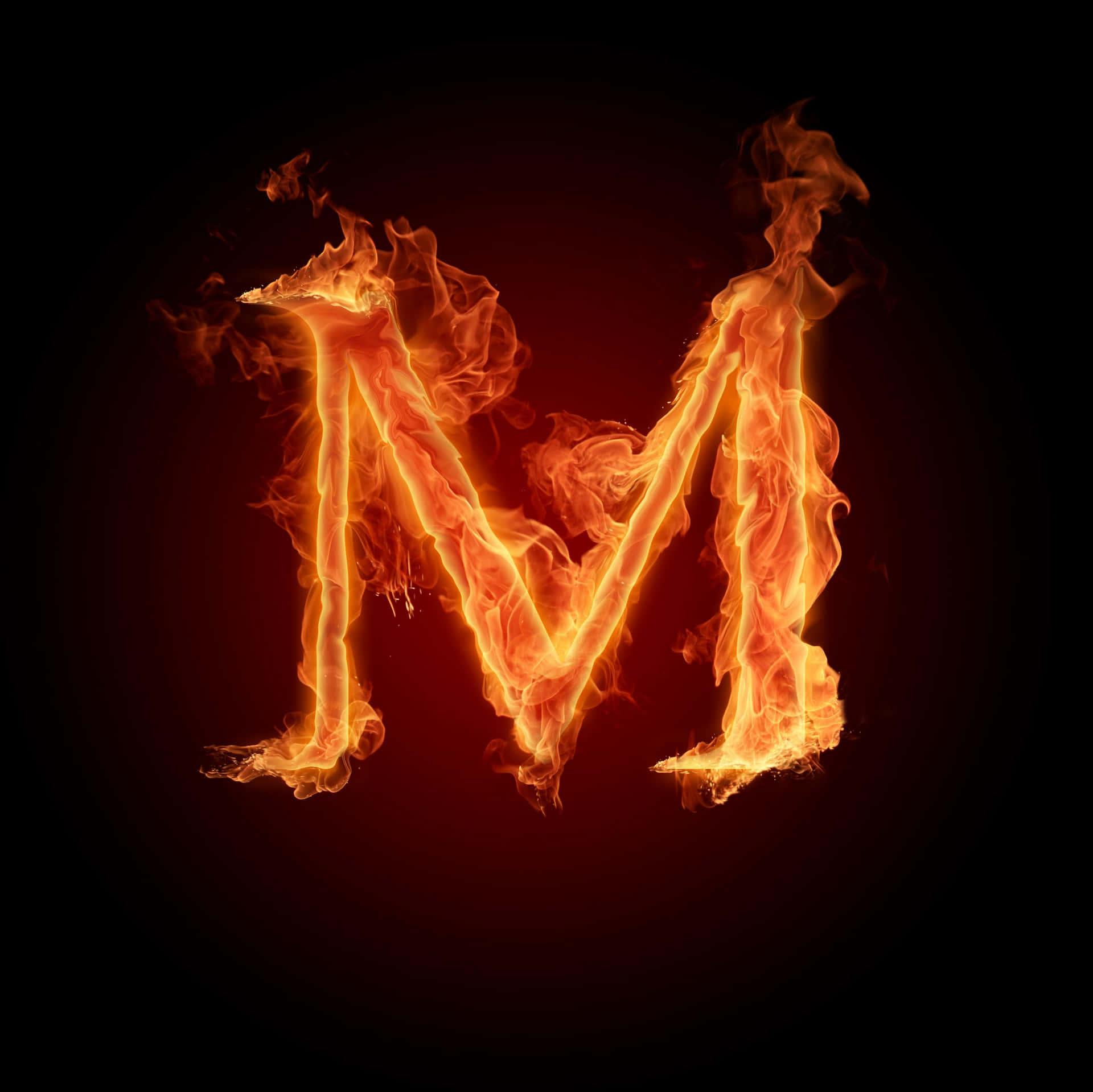 A Letter M In Fire On Black Background Wallpaper
