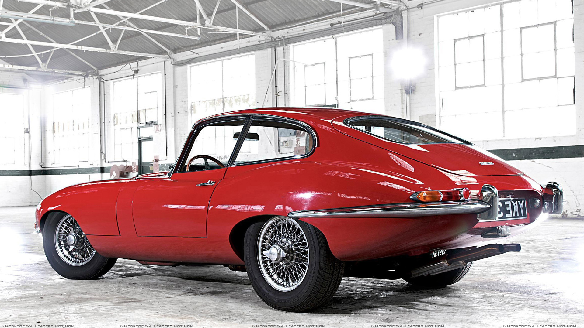 Jaguar E Type Coupe Side Back Pose In Red Wallpaper