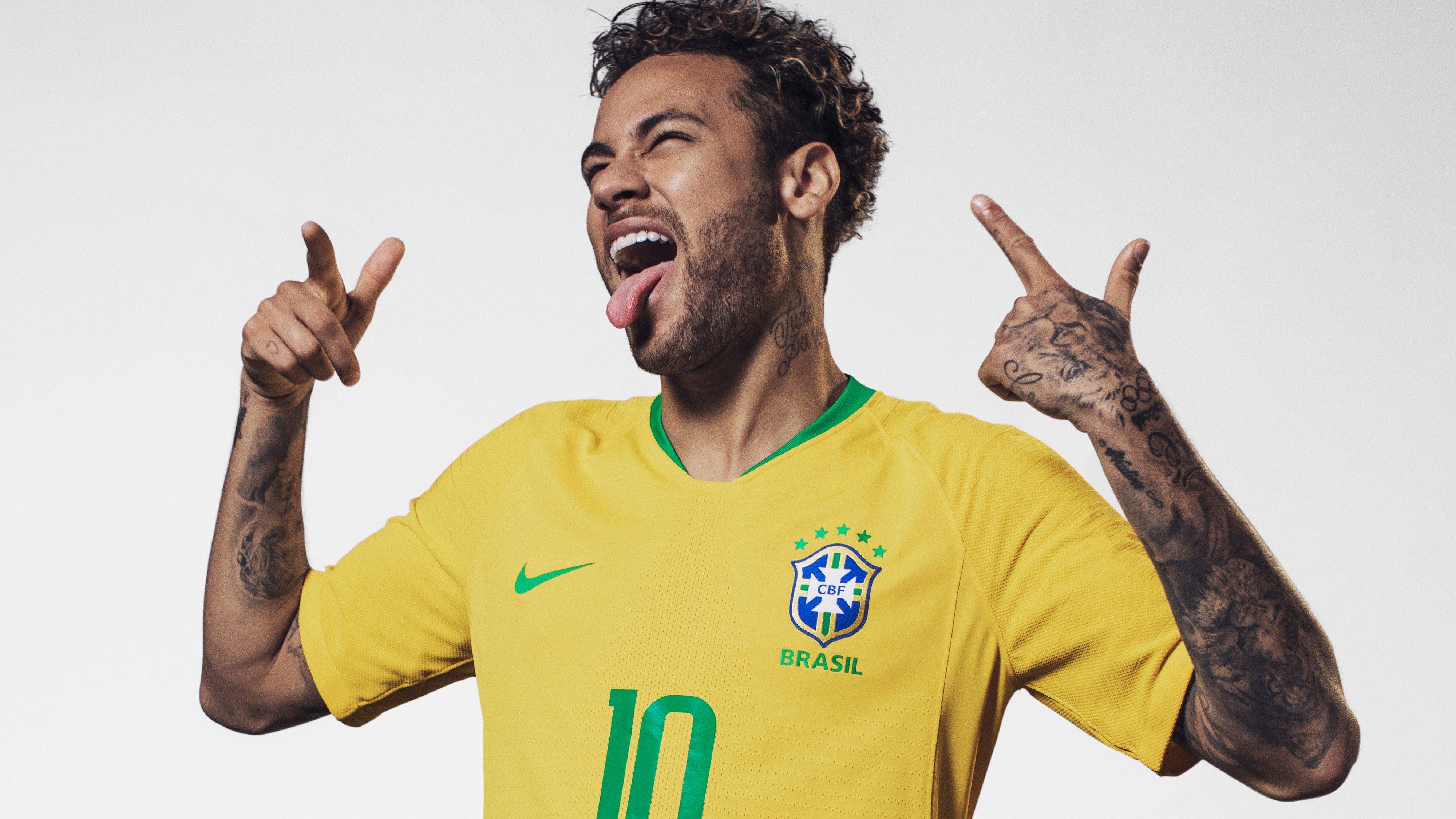 Neymar Jr. posing in a Brazil national team jersey