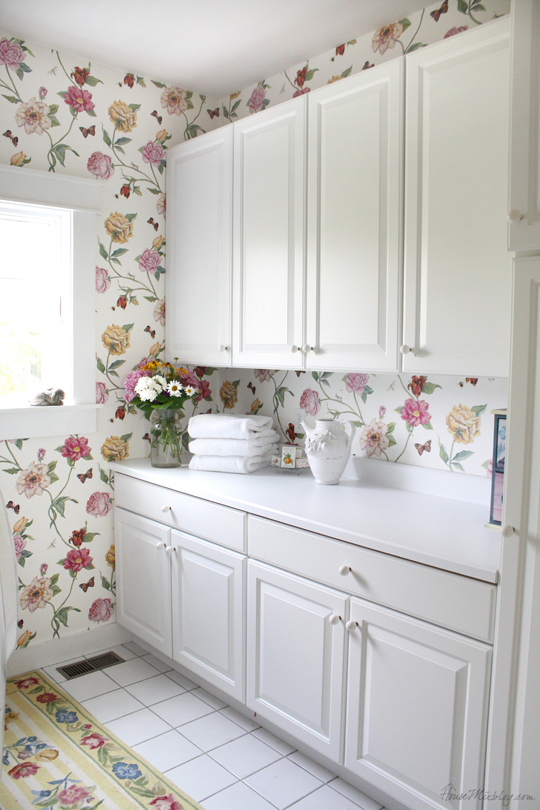 Country House Laundry Room With White Cabis And Floral Wallpaper
