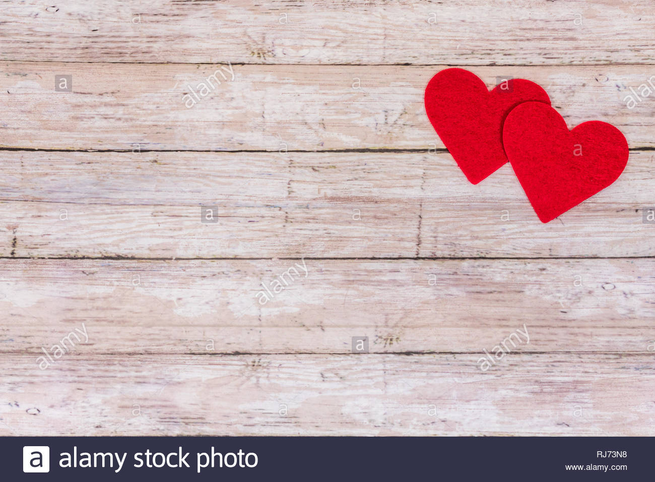 White wooden Saint Valentines day background with red hearts