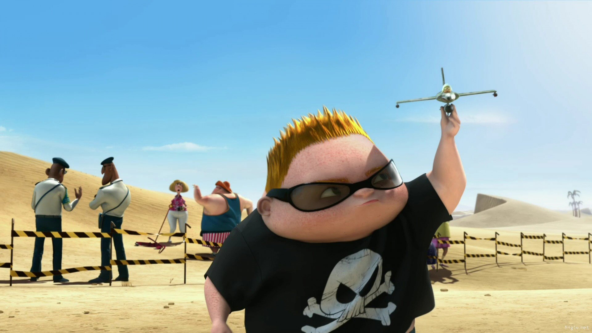 A child from Despicable Me plays with a toy airplane in the desert