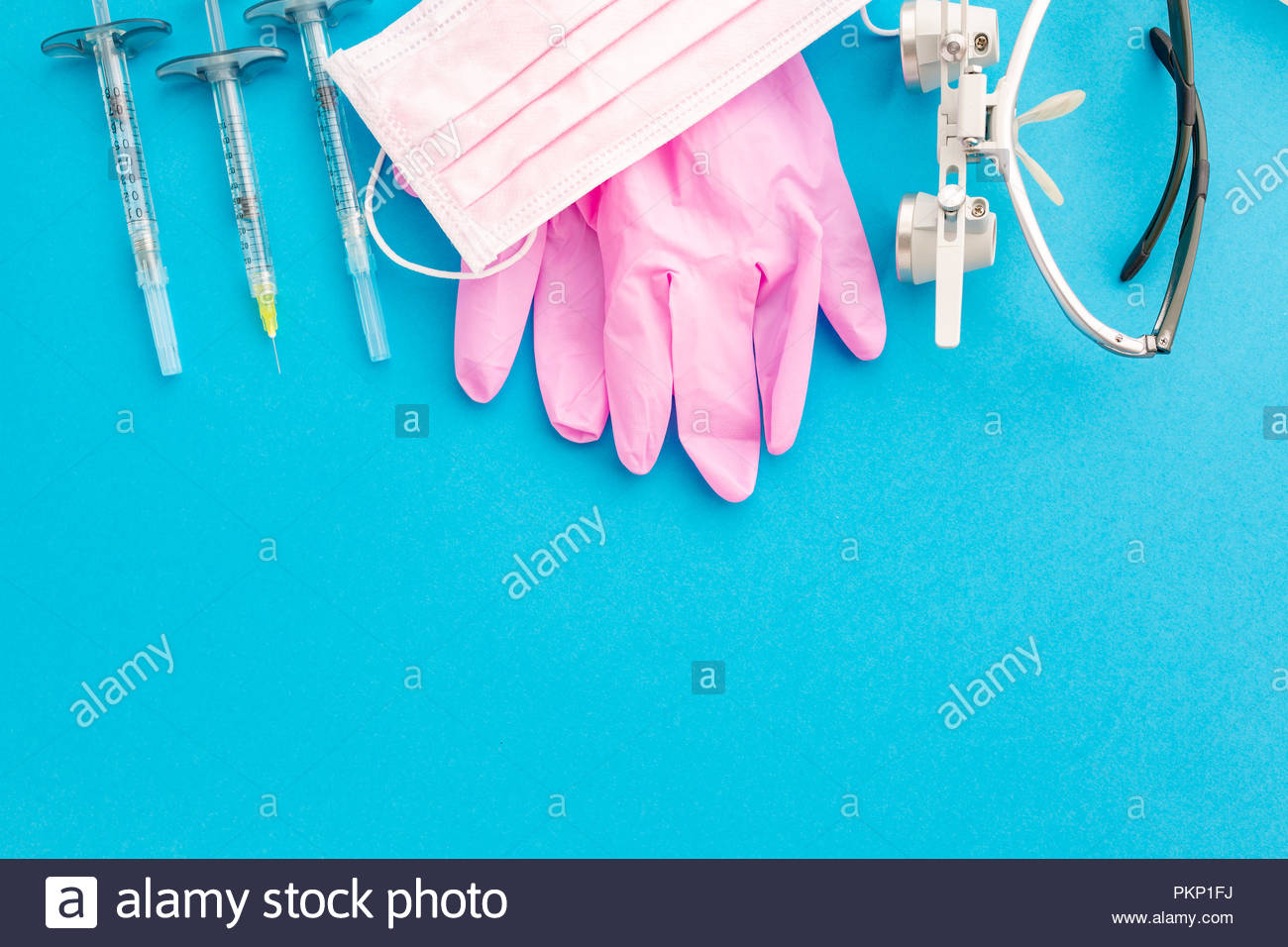 Medical Equipments Including Surgical Instruments On A Blue