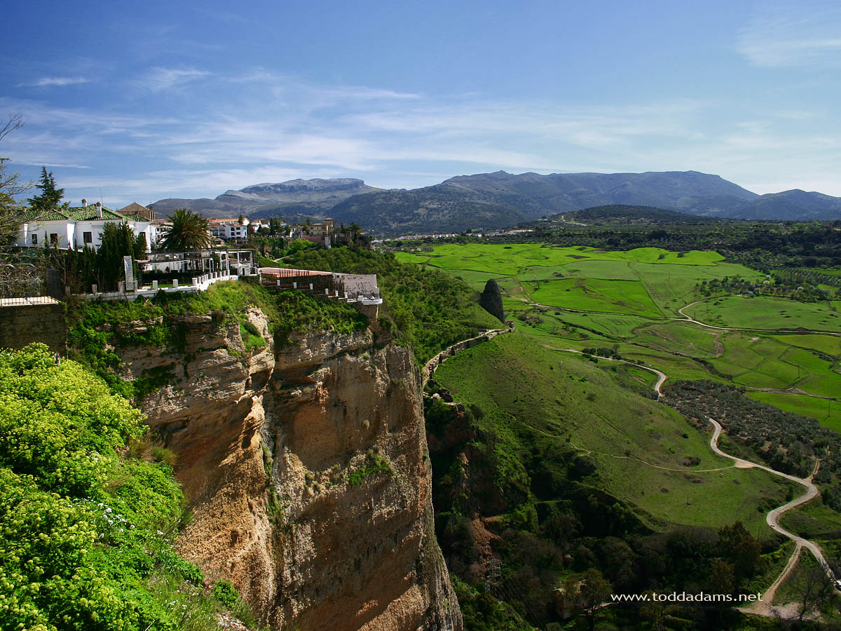 The Lush Green Valley Below Town Of Ronda As Seen From