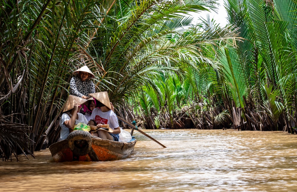 Group Of People Riding On Canoe Photo Mekong River Delta