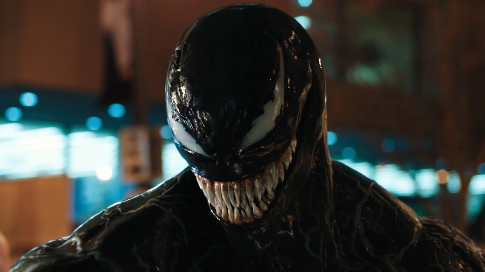 Close-up of Venom's face, showcasing his sharp teeth and menacing expression